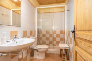 a bathroom with a sink and a toilet and a shower at Casa Ramona in Conques +42 photos