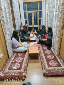 a group of people sitting in a room at Shugu a village home stay in Gondla