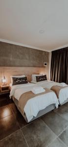 a large bedroom with two beds in it at Livingwaters Self-Catering Accommodation in Ermelo