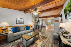 a living room with a couch and a table at On Dolly Time Slow Down and Stay Awhile in Pigeon Forge