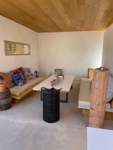a living room with a couch and a table at 4u Bed & Spa in Opoul-Périllos