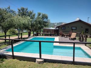 a swimming pool with a fence around it at Bella Vista in Bialet Massé