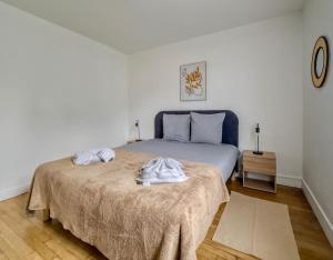 Postel nebo postele na pokoji v ubytování Le 33 Green Stay