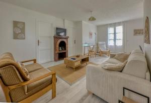 TV a/nebo společenská místnost v ubytování Le 33 Green Stay