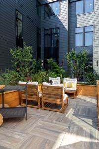 a patio with two chairs and a table at Inkwell Charlotte in Charlotte