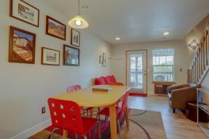 a dining room with a table and red chairs at 13 Lodge in Hood River +15 photos