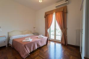 Postel nebo postele na pokoji v ubytování Bed and Breakfast Nonna Loreta