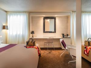Postel nebo postele na pokoji v ubytování Mercure Le Mans Batignolles - Hotel & Spa