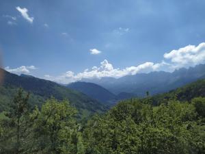 a view of a valley with trees and mountains at Studio plein sud avec vue magnifique in Château-Bernard +4 photos