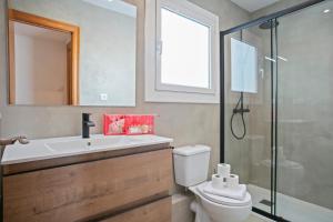 a bathroom with a toilet and a sink and a shower at Alcam Terrassa in Terrassa +11 photos