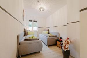 Ένα ή περισσότερα κρεβάτια σε δωμάτιο στο Auszeit Domizile