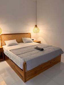 En eller flere senge i et værelse på PAN Homestay