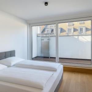 Ένα ή περισσότερα κρεβάτια σε δωμάτιο στο Home Sweet Home - Vienna Central