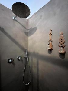 a bathroom with a shower with a shower head at Dimora Tauro B&B in Fasano +34 photos
