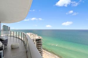 a view of the ocean from the balcony of a building at Dreamy Beachside Living - Direct Oceanview 2BR 2BA for the Perfect Escape in Hollywood
