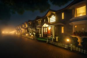 a row of houses on a street at night at JC Residency in Kodaikānāl
