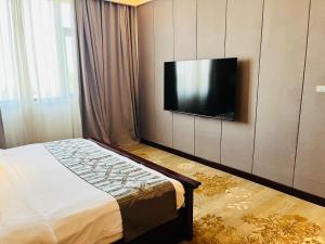 TV a/nebo společenská místnost v ubytování Sunbelt Hotels and Suites International