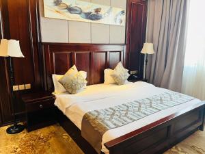 Postel nebo postele na pokoji v ubytování Sunbelt Hotels and Suites International