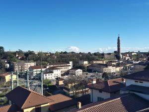 a view of a city with mountains in the background at La nuova casa di Giove in Palazzolo sullʼOglio