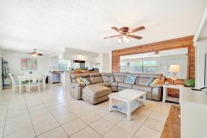a living room with a couch and a table at Blissful Beach Retreat AB in Punta Gorda Beach