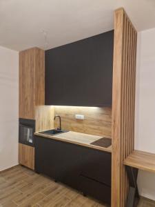 Kuchyň nebo kuchyňský kout v ubytování Zmaj 28