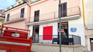 a red bench in front of a building at B&B Mauro in Gioia Sannitica +12 photos