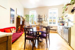 a kitchen and dining room with a table and chairs at Family place in Old town/center in Liberec +16 photos