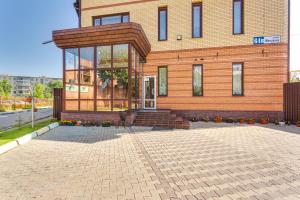 a building with a glass door in front of it at Home Room "На Мирном" in Obninsk