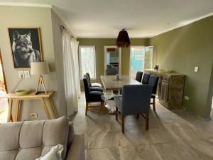 a living room with a table and a couch at Kanoo Lodge in Tigre +12 photos