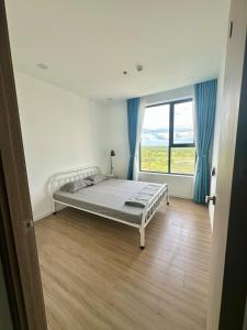 Ένα ή περισσότερα κρεβάτια σε δωμάτιο στο Phòng ngủ riêng trong căn hộ hiện đại Thủ Đức