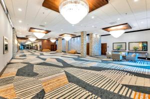 a lobby with a large rug on the floor at Crowne Plaza Hotel Foster City-San Mateo by IHG in Foster City