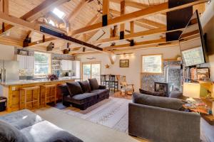 a living room with couches and a kitchen at 7 Mi to Bilgers Rocks Secluded 7-Acre Retreat in Clearfield