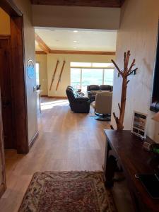 a living room with a couch and a table at 7 Bdr 5 ba Amazing View Amenities Fido can join in Eden