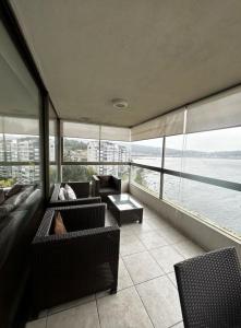 a living room with a view of the water at Departamento en Pingueral, Vista Maravillosa in Dichato