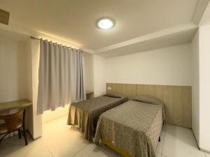 Giường trong phòng chung tại Annamar Hotel +59 ảnh