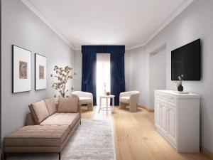 a living room with a couch and a tv at Hotel Livata Mountain & Wellness in Subiaco +6 photos