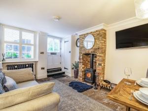 a living room with a couch and a fireplace at 1 Bed in Richmond 88054 in Richmond
