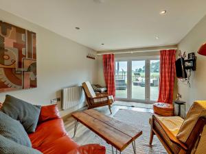 a living room with a couch and a table at 2 Bed in Richmond 74305 in Barton