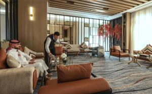 two men are standing in a hotel lobby at AW Hotel Riyadh in Riyadh +107 photos