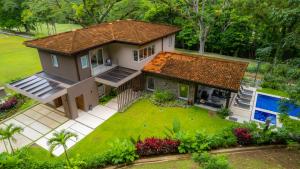 an overhead view of a house with a yard at Casa Selva Tica 6 bdr pool golf view in Los Suenos in Herradura