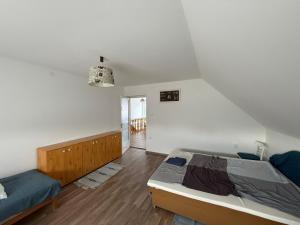 a bedroom with a bed and a bed at Chill & Pool Retreat Almádi in Balatonalmádi