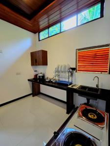 a kitchen with a counter and a sink in a room at Forina Villa in Walliwala East