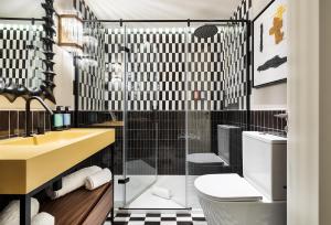a bathroom with a sink and a toilet at One Shot La Latina in Madrid +20 photos