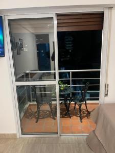 a view of a balcony with a table and chairs at cerca de costa y centro con cochera in Corrientes +1 photo