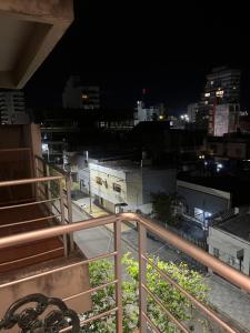 a view of a city at night from a balcony at cerca de costa y centro con cochera in Corrientes
