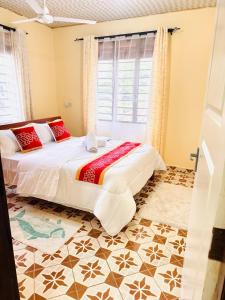 Ένα ή περισσότερα κρεβάτια σε δωμάτιο στο Mauville Diani