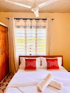 Ένα ή περισσότερα κρεβάτια σε δωμάτιο στο Mauville Diani