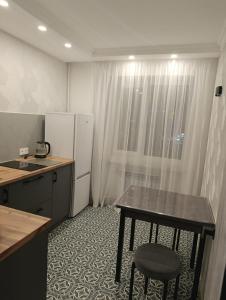 Køkken eller tekøkken på Уютная квартира в центре!