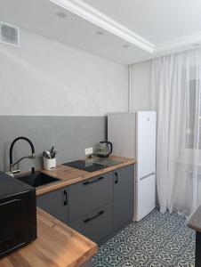 Køkken eller tekøkken på Уютная квартира в центре!