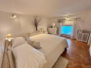 Postel nebo postele na pokoji v ubytování La casa del Capitano B&b